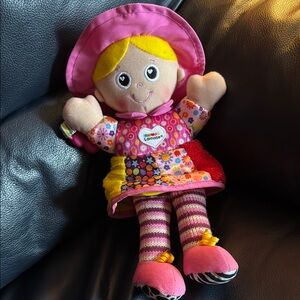 Lamaze Pink Hanging crinkle and rattle maker doll.